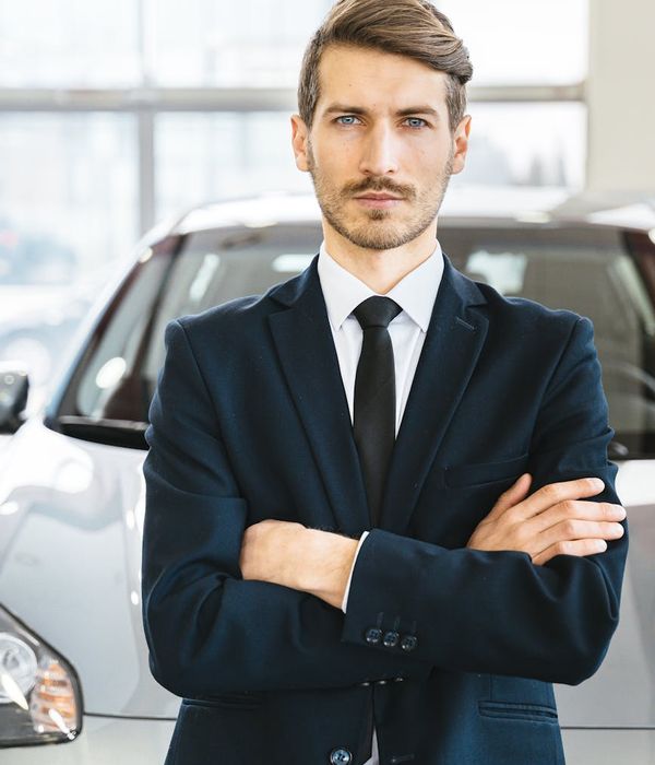 Confident male automotive specialist in professional attire