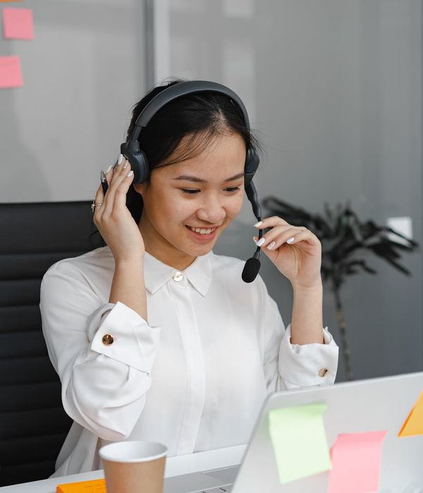 Friendly female service consultant in modern auto center