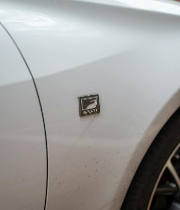 Luxury sedan with mirror-finish paint after professional detailing